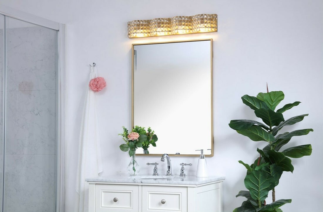 Ollie Brass Crystal 4-Light Wall Sconce 26.8 inch: Ollie Brass Crystal 4-Light Wall Sconce 26.8 inch This modern wall sconce features a brass finish and is accented with royal cut crystals, providing a stylish and elegant lighting solution for indoor 