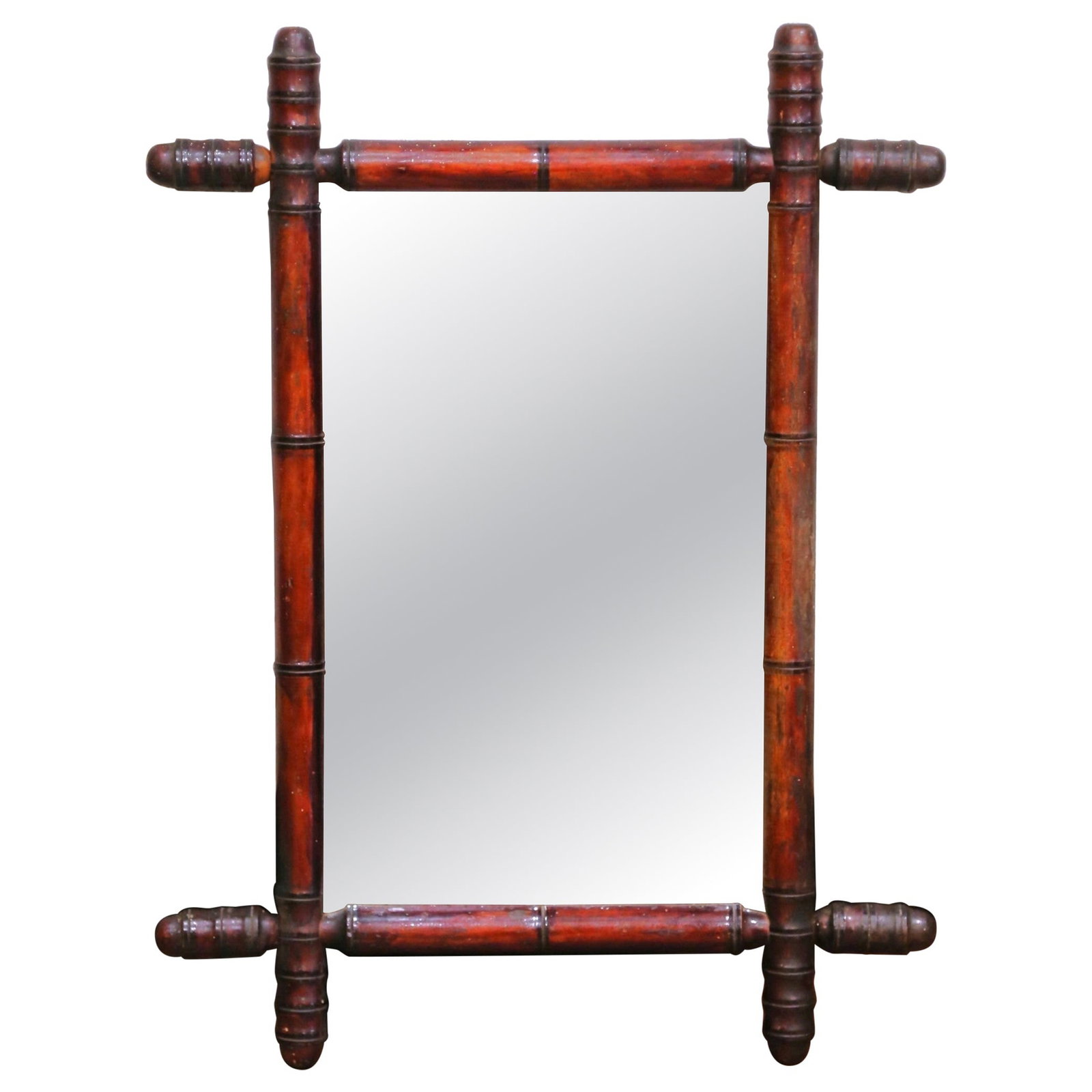 French Country Style Faux Bamboo Wall Mirror Circa 1920: French Country Style Faux Bamboo Wall Mirror Circa 1920 This early 20th-century French wall mirror features a hand-crafted faux bamboo frame made from walnut, with decorative spindle finials at the co