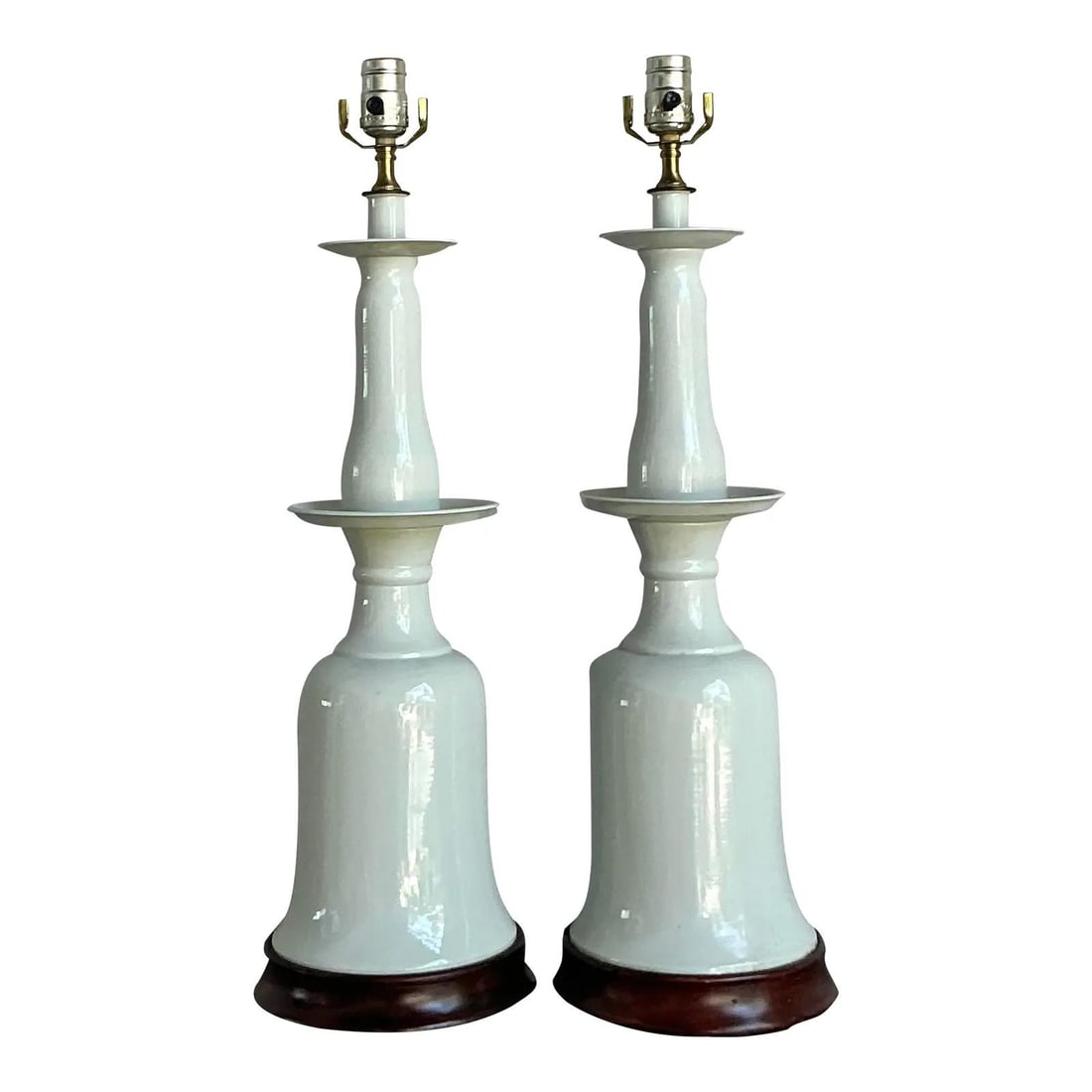 Pair of White Glazed Ceramic Bell Table Lamps with Wood Bases: Pair of White Glazed Ceramic Bell Table Lamps with Wood Bases This pair of vintage Regency table lamps features high-gloss white glazed ceramic in a striking, stacked silhouette with a bell-shaped bod