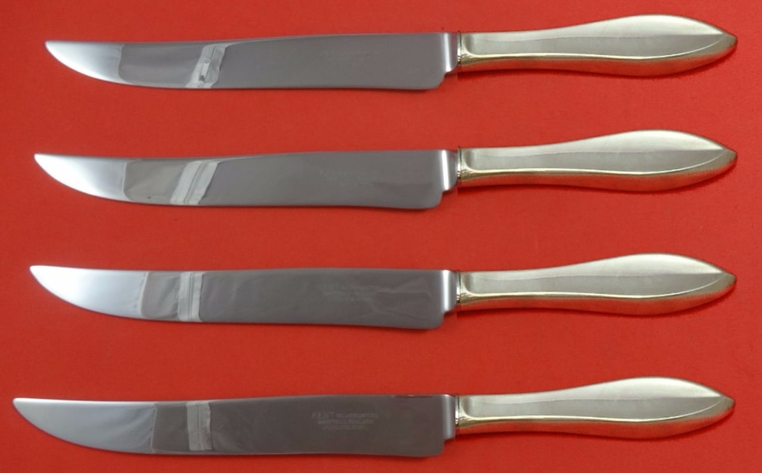 Gorham Esprit sterling silver steak knives 4 piece Texas sized: Gorham Esprit sterling silver steak knives 4 piece Texas sized This set includes four large steak knives in the Esprit pattern by Gorham. Each knife features a sterling silver hollow handle paired wit