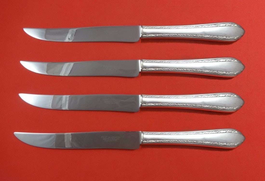 Royal Crest Wild Flower Sterling Silver 4-Piece Texas Sized Steak Knife Set: Royal Crest Wild Flower Sterling Silver 4-Piece Texas Sized Steak Knife Set Introducing the Wild Flower Sterling Silver Steak Knife Set by Royal Crest, a luxurious addition to your flatware collection
