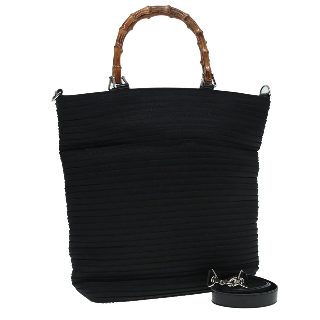 Gucci Vintage Bamboo Handle Nylon Bag: Gucci Vintage Bamboo Handle Nylon Bag This Gucci Vintage Bamboo Handle Bag features a black nylon exterior complemented by iconic bamboo handles. Designed for women, the bag showcases Italian craftsma