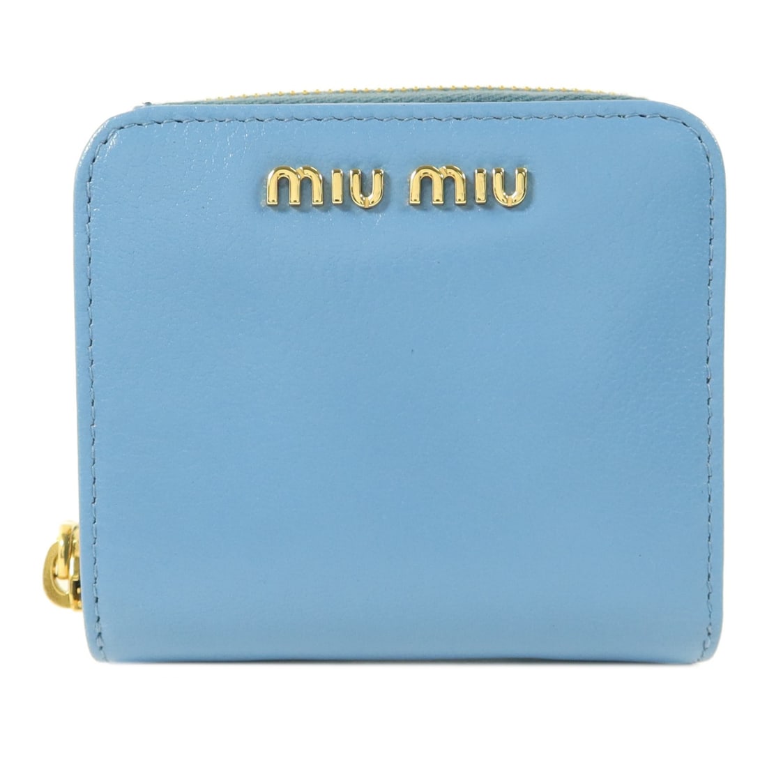 Miu Miu Blue Lambskin Bi-Fold Wallet GHW: Miu Miu Blue Lambskin Bi-Fold Wallet GHW This Miu Miu compact bifold wallet is crafted from soft lambskin leather in a striking blue color. Designed for women, it features a sleek and practical bifold