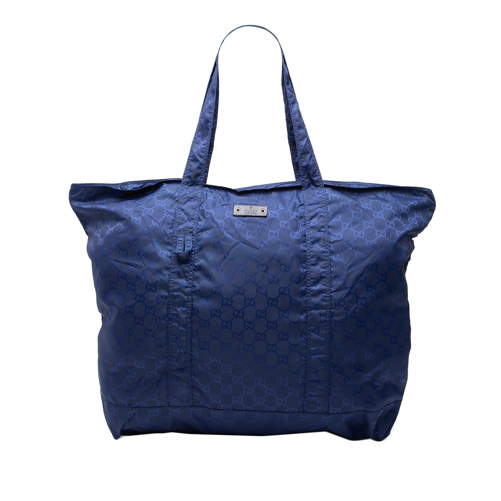 Gucci GG Teddy Bear Nylon Folding Tote Bag with Pouch: Gucci GG Teddy Bear Nylon Folding Tote Bag with Pouch This Gucci GG Nylon Teddy Bear Folding Tote features a blue nylon body with flat nylon handles, an open top, an exterior front slip pocket, and a 