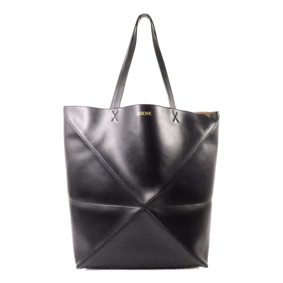 LOEWE Puzzle Fold Black Calfskin Tote Bag: LOEWE Puzzle Fold Black Calfskin Tote Bag This LOEWE Puzzle Fold Tote is crafted from premium calfskin leather in a sleek black color. Designed for women, this regular size tote bag offers ample space