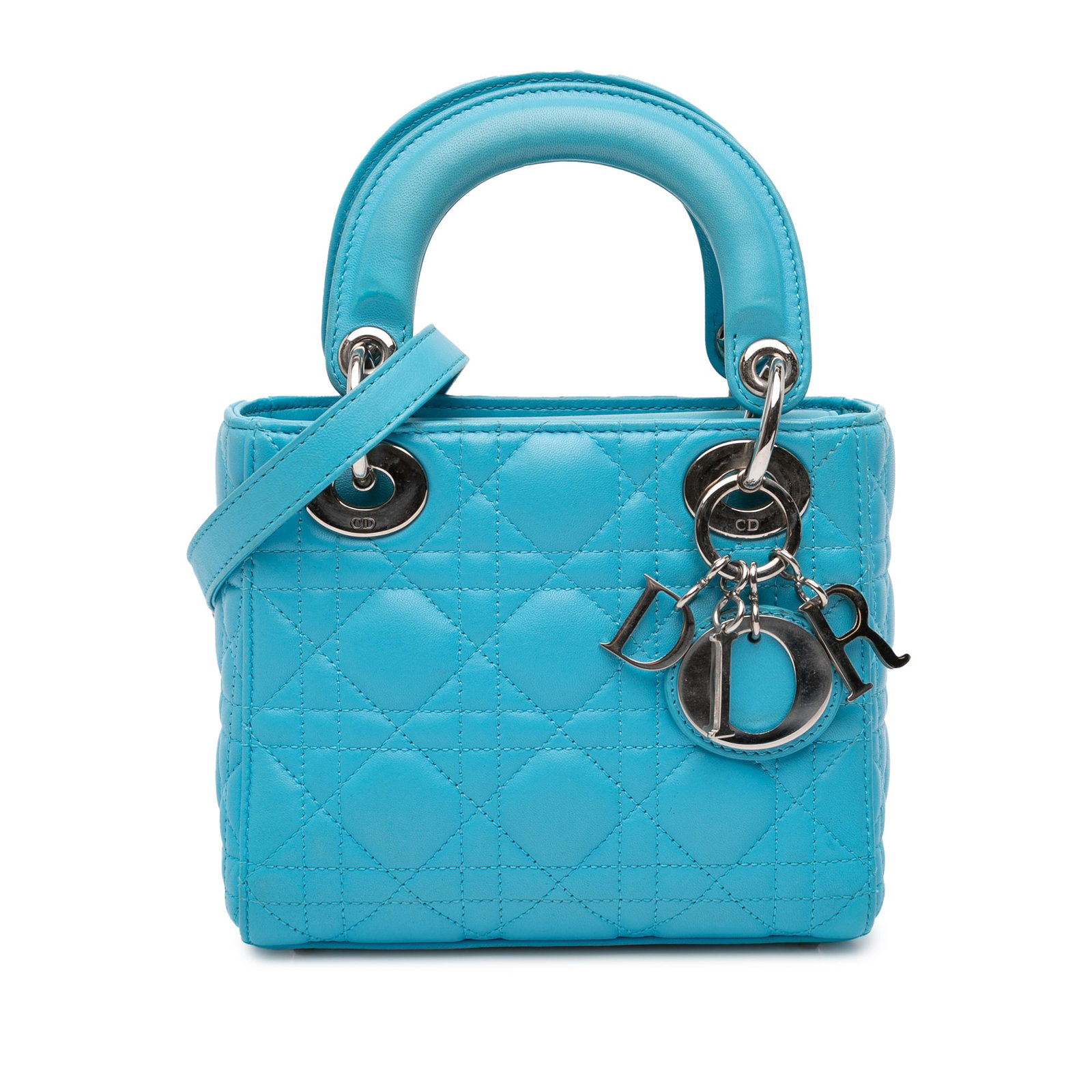 Dior Mini Cannage Lambskin Lady Dior Blue Bag: Dior Mini Cannage Lambskin Lady Dior Blue Bag The Mini Lady Dior is a sophisticated handbag crafted from luxurious quilted lambskin leather, featuring a striking blue color. This elegant bag includes 