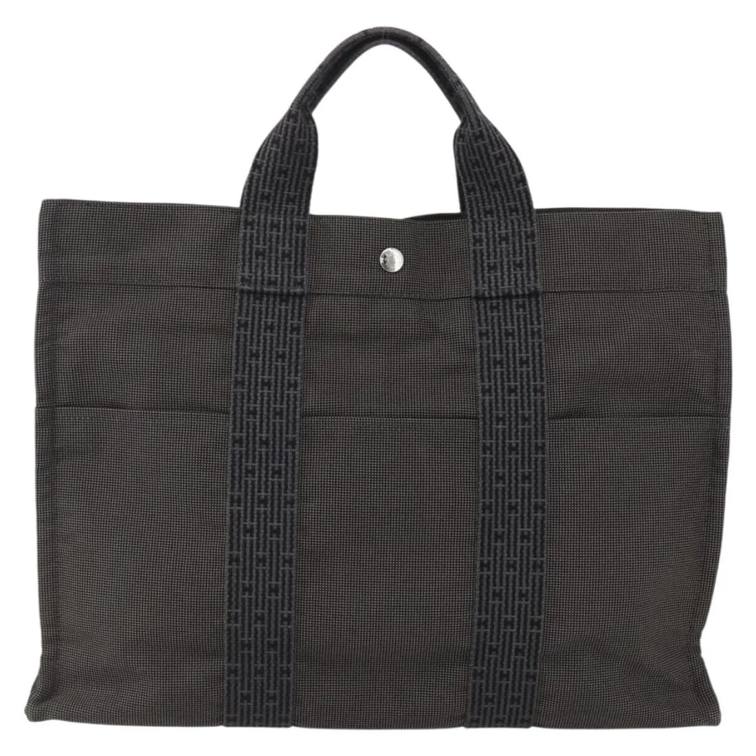 Hermes Gray Canvas Tote Bag Fourre-tout Herline 42cm by 31cm by 10cm: Hermes Gray Canvas Tote Bag Fourre-tout Herline 42cm by 31cm by 10cm This pre-owned Hermes Fourre-tout Herline tote bag for women features a gray canvas construction with metal fittings. The bag has a