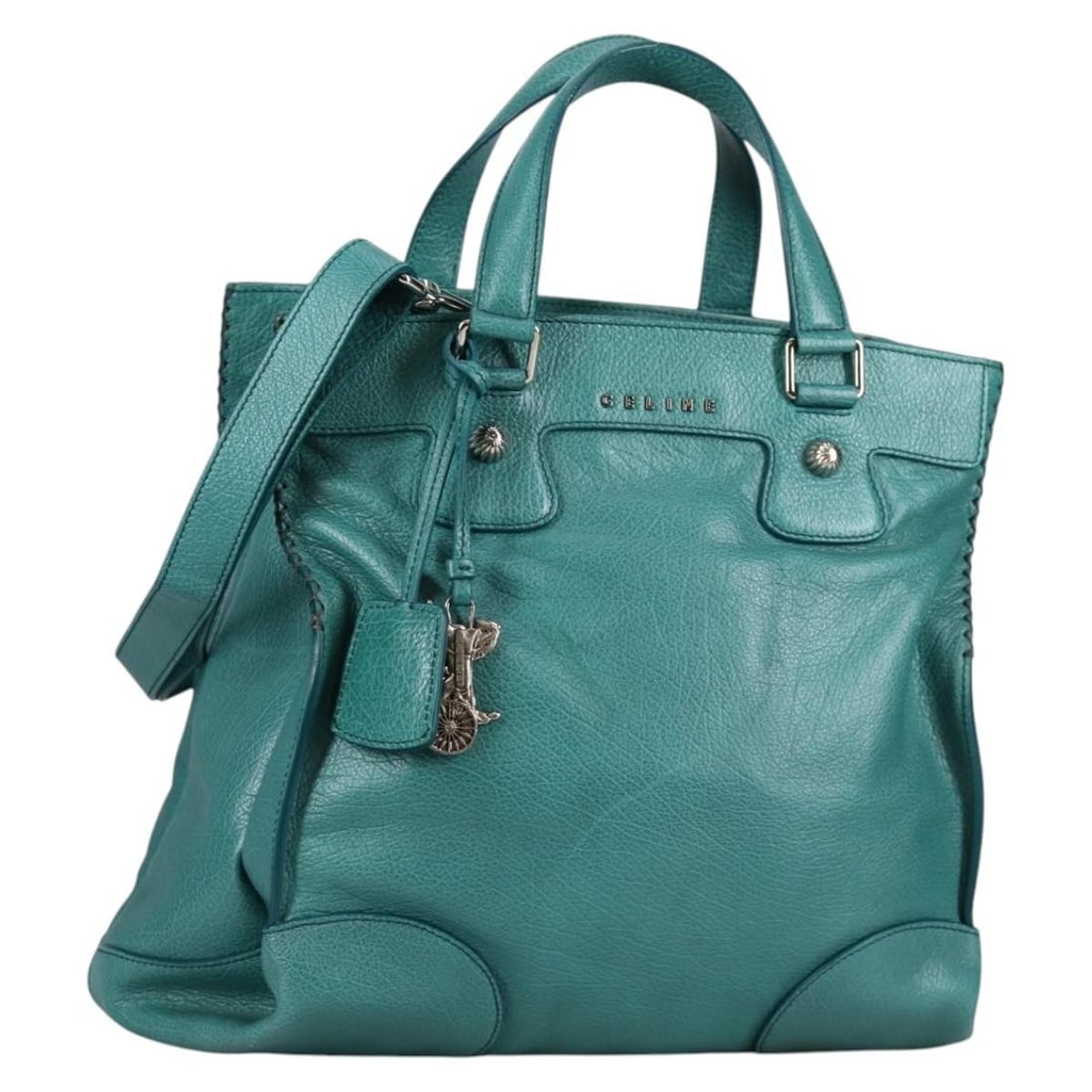 CELINE turquoise blue leather shoulder bag with dust bag: CELINE turquoise blue leather shoulder bag with dust bag This CELINE handbag features a versatile 2-way design crafted from turquoise blue leather with silver-tone accents. The bag offers both a top h