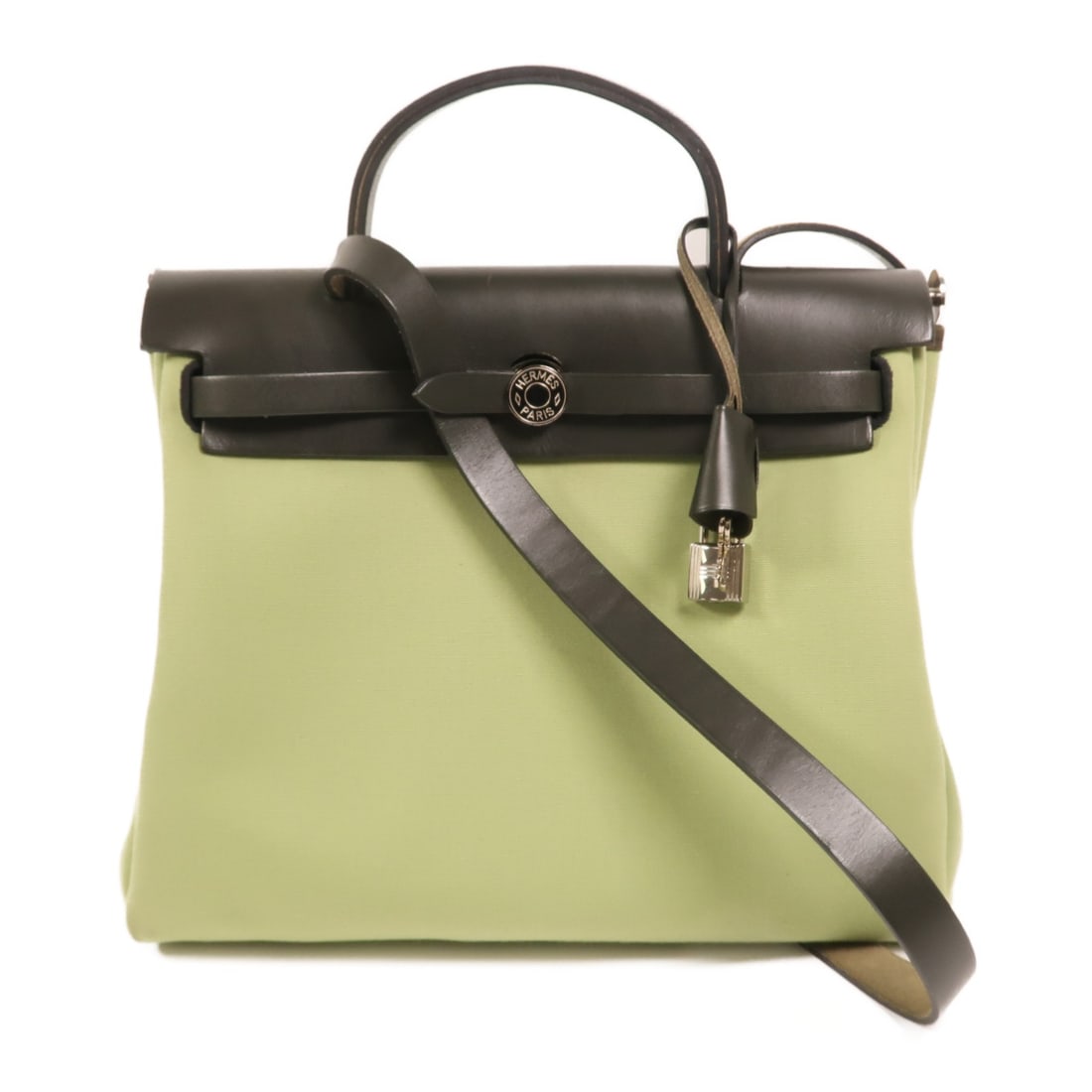 Herbag PM Canvas Green Shoulder Bag with Palladium Hardware by Hermes: Herbag PM Canvas Green Shoulder Bag with Palladium Hardware by Hermes This Hermes Herbag PM 2-way shoulder bag features green canvas with palladium hardware. Designed for women, it offers versatile st