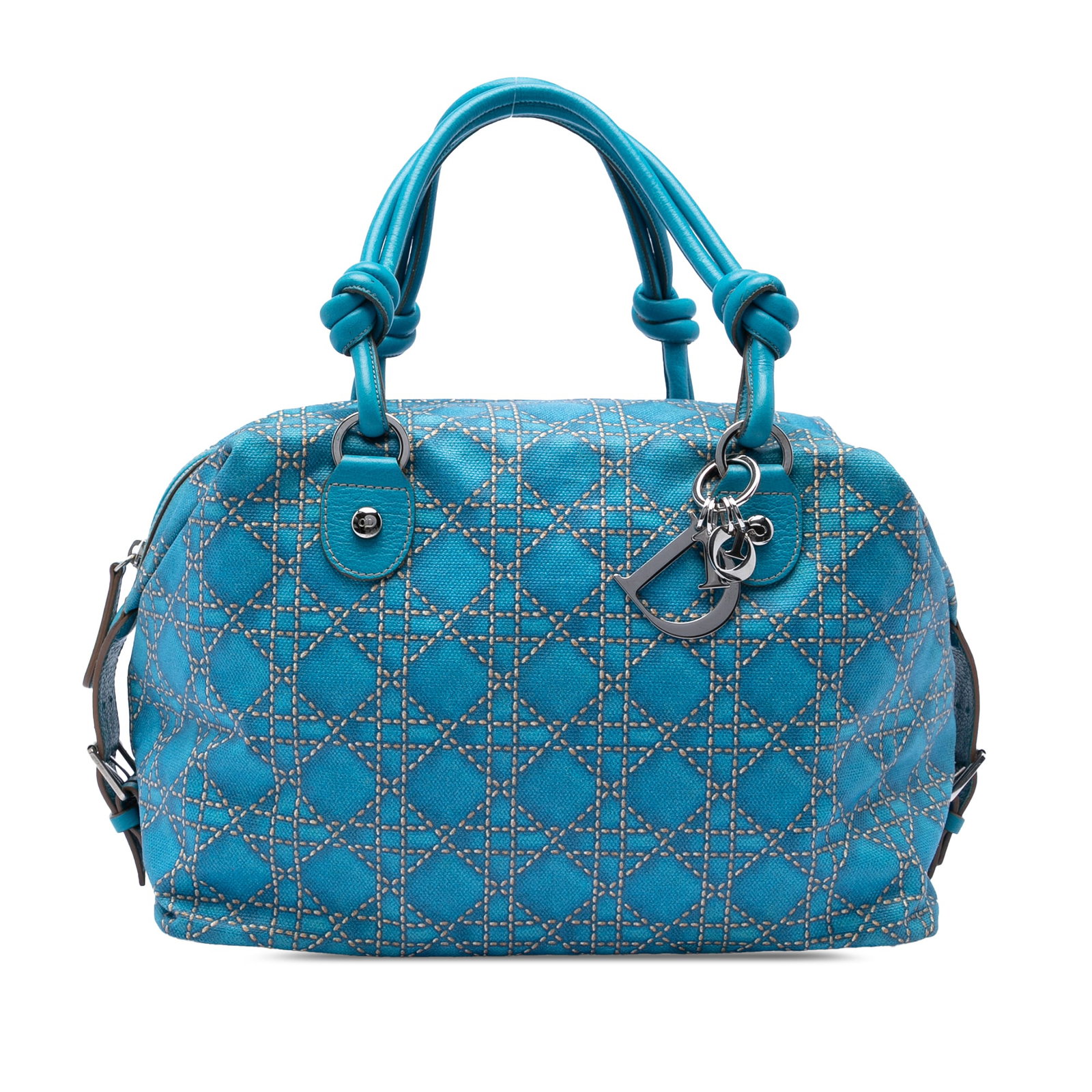 Dior Cherie Blue Canvas Cannage Print Handbag: Dior Cherie Blue Canvas Cannage Print Handbag This Dior Canvas Cannage Print Cherie Handbag features a printed canvas exterior with rolled leather handles accented by knot details. The bag is equipped