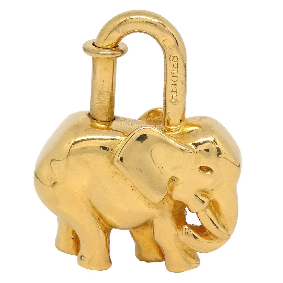 Hermes Elephant Motif Cadena Lock Charm Gold Plated 1988: Hermes Elephant Motif Cadena Lock Charm Gold Plated 1988 Vintage Hermes elephant motif cadena lock bag charm in gold-plated metal. This unisex charm features the iconic elephant design and shows light