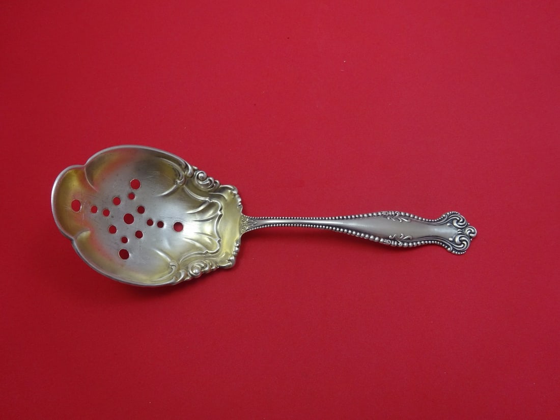 Towle Canterbury Sterling Silver Pea Spoon Gold Wash 8 7/8": Towle Canterbury Sterling Silver Pea Spoon Gold Wash 8 7/8" This exquisite Canterbury pattern serving spoon by Towle is crafted from sterling silver and features a luxurious gold wash. Measuring 8 7/8