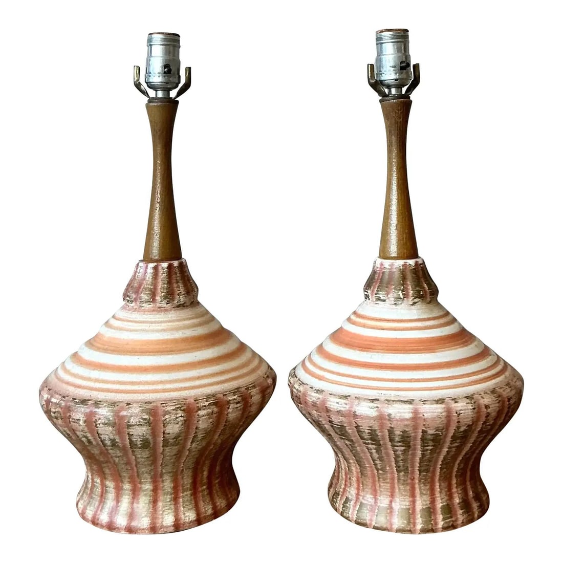 Pair of Mid-Century Ceramic and Wood Table Lamps with Glazed Finish: Pair of Mid-Century Ceramic and Wood Table Lamps with Glazed Finish This pair of Mid-Century Modern table lamps, dating from the 1960s, features a harmonious blend of ceramic and wood elements. Each l