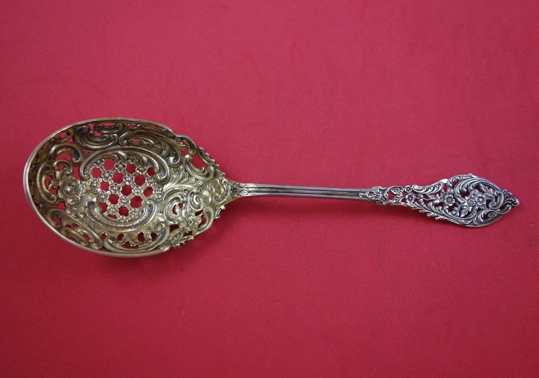 Dominick & Haff Trianon Pierced Sterling Silver Ice Spoon Gold Wash 7.5": Dominick & Haff Trianon Pierced Sterling Silver Ice Spoon Gold Wash 7.5" This exquisite Trianon Pierced ice spoon, crafted by Dominick & Haff, showcases the elegance of sterling silver design from the