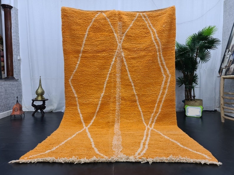 Authentic Moroccan Berber Handmade Orange Wool Rug 10 x 5 Feet: Authentic Moroccan Berber Handmade Orange Wool Rug 10 x 5 Feet Enhance your living space with this stunning handmade orange wool rug, crafted with care by local Berber women weavers in the Atlas Mount