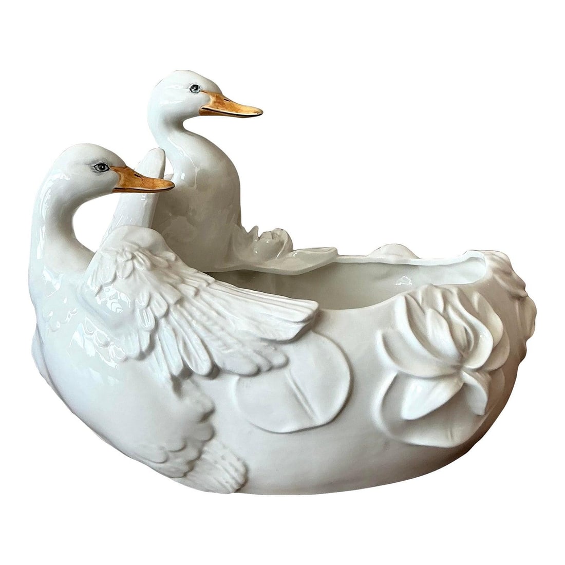 Hollywood Regency Ceramic Bowl with Sculpted Ducks and Gold Detail: Hollywood Regency Ceramic Bowl with Sculpted Ducks and Gold Detail This vintage Hollywood Regency glazed ceramic centerpiece bowl features elegantly sculpted ducks surrounded by floral and lily pad mo