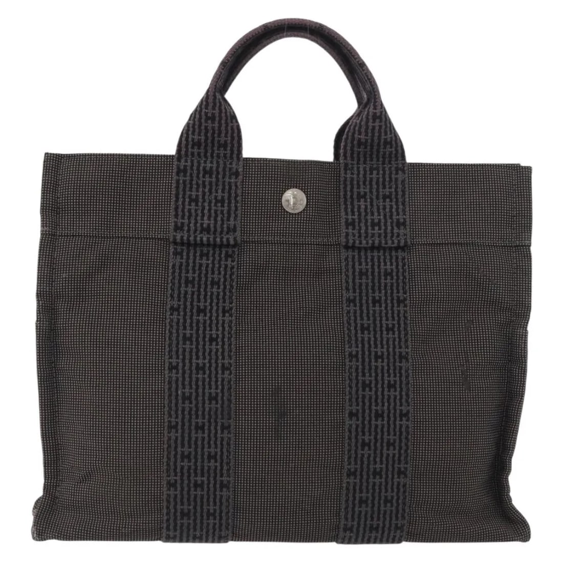 Fourre-tout Herline gray canvas tote bag by Hermes France: Fourre-tout Herline gray canvas tote bag by Hermes France This Hermes Fourre-tout Herline Canvas bag features a gray canvas exterior with a structured silhouette. Designed for women, it offers practic