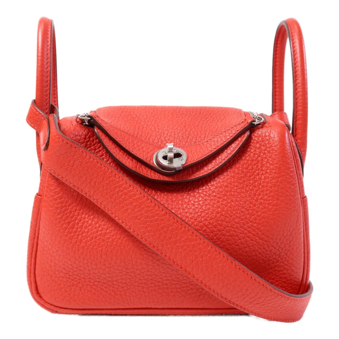 Hermes Mini Lindy Rouge de Coeur Calfskin 2 Way Shoulder Bag PHW: Hermes Mini Lindy Rouge de Coeur Calfskin 2 Way Shoulder Bag PHW This HERMES Mini Lindy 2-way shoulder bag is crafted from Clemence calfskin leather in a striking Rouge de Coeur red. Designed for vers