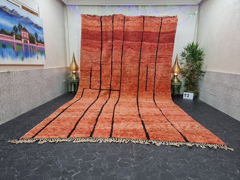 Authentic Handmade Moroccan Berber Wool Rug 13x5 Feet: Authentic Handmade Moroccan Berber Wool Rug 13x5 Feet Transform your space with this large, authentic, and stylish handmade Moroccan Berber wool rug, featuring eye-catching black pattern lines. Each r