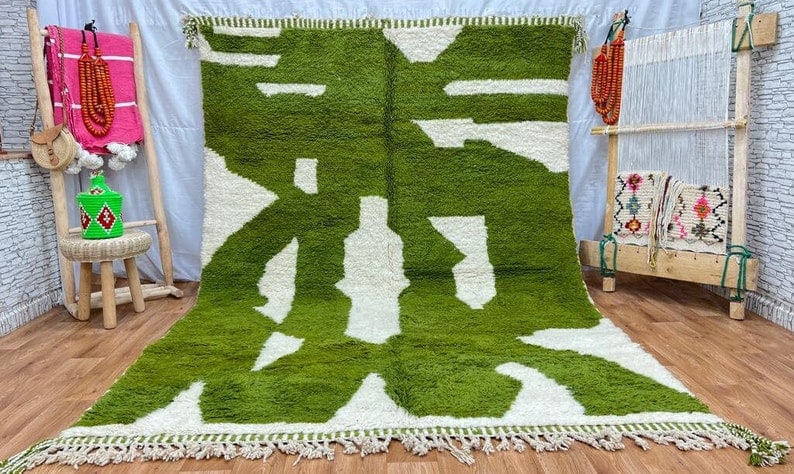Handwoven Moroccan Rug in Soft Green and White: Handwoven Moroccan Rug in Soft Green and White This stunning soft green and white rug is handwoven in the Atlas Mountains by local Berber women using traditional tools and natural local wool. It featu