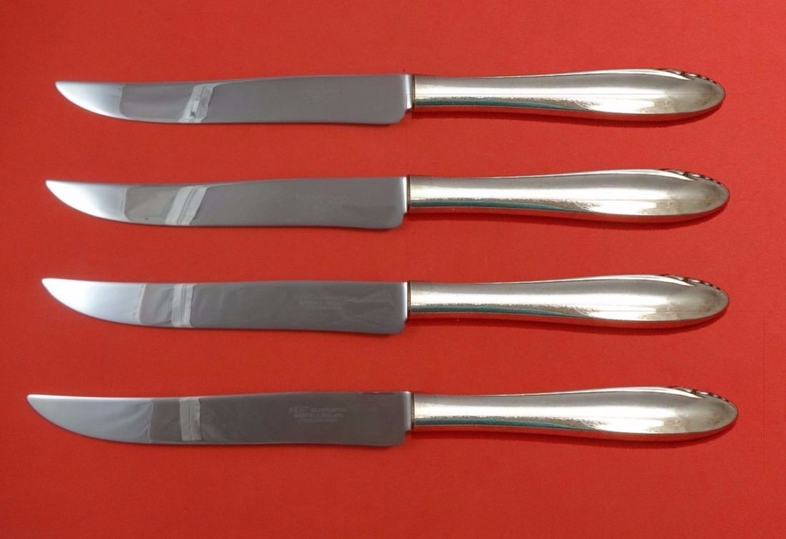 Oneida Lasting Spring Sterling Silver Steak Knife Set 4pc Texas Sized: Oneida Lasting Spring Sterling Silver Steak Knife Set 4pc Texas Sized Introducing the Lasting Spring Steak Knife Set by Oneida, a stunning collection of four Texas-sized knives designed for exceptiona