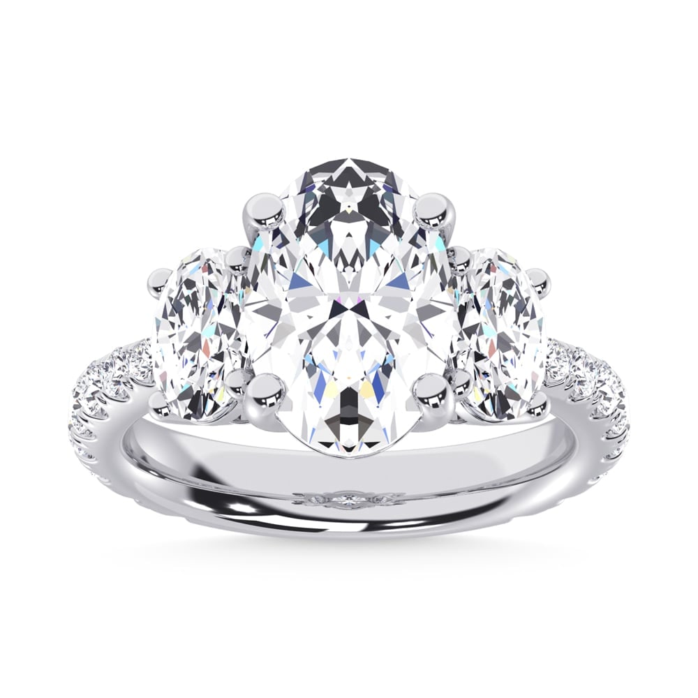 14K White Gold Lab Grown Diamond 6 5/8 Ct.Tw. Oval Shape Three Stone Ring: 14K White Gold Lab Grown Diamond 6 5/8 Ct.Tw. Oval Shape Three Stone Ring This stunning three-stone ring features a sparkling 4 CT Oval Center diamond with two shimmering side diamonds, symbolizing pa