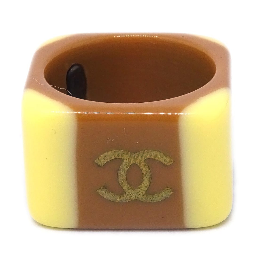 Vintage Chanel Acrylic Ring Brown Size 12 01A: Vintage Chanel Acrylic Ring Brown Size 12 01A Vintage Chanel acrylic ring in brown with yellow accents. This ring is made in France and marked 01A. It is in very good condition overall, with rust note
