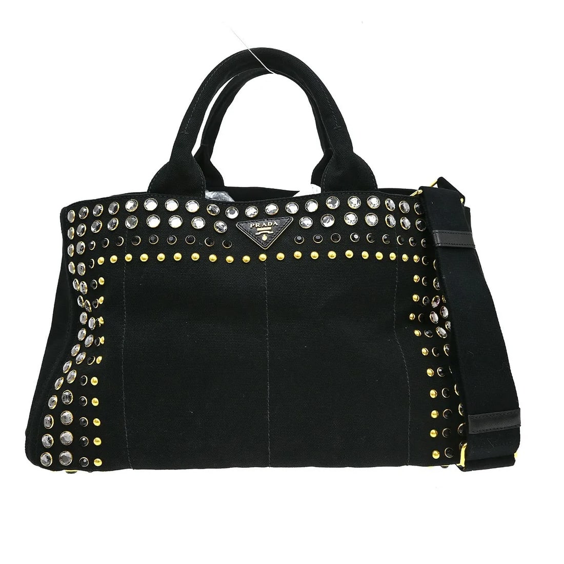 Prada Canapa Convertible Tote in Black Canvas: Prada Canapa Convertible Tote in Black Canvas Prada Canapa Convertible Tote in black canvas with rhinestone embellishment. This women's bag is made in Italy and is in good condition, showing corner sc