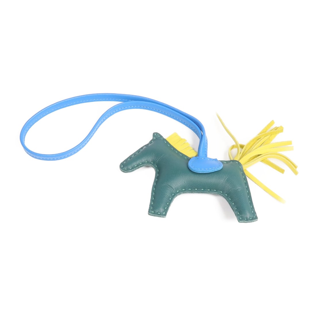 Hermes Rodeo PM Lambskin Bag Charm in Green Yellow and Blue: Hermes Rodeo PM Lambskin Bag Charm in Green Yellow and Blue This Hermes Rodeo PM charm is crafted from Milo lambskin leather in a vibrant combination of green, yellow, and blue. Designed as a stylish 