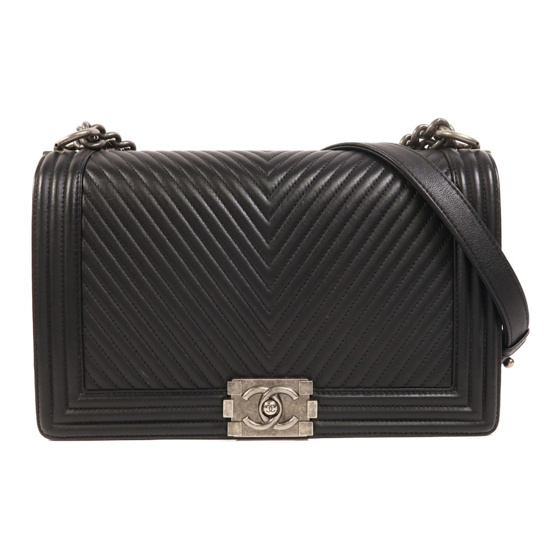 Chanel Boy 28 Black Calfskin Shoulder Bag with Silver Tone Chain: Chanel Boy 28 Black Calfskin Shoulder Bag with Silver Tone Chain This CHANEL Boy Chain Shoulder Bag is crafted from black calfskin leather and designed for women. It features a silver-tone CC clasp an