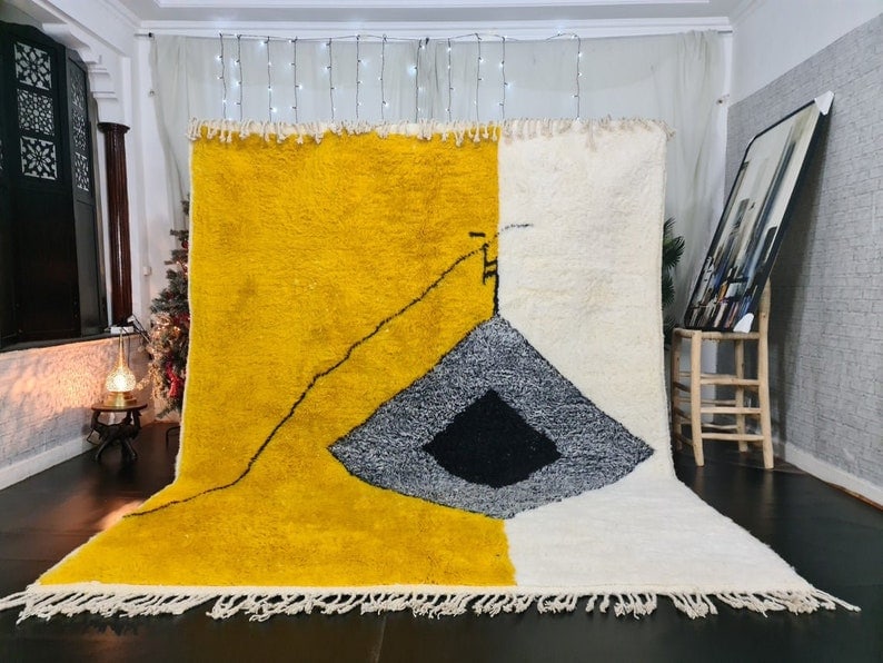 Handmade Moroccan Berber Wool Area Rug Yellow White Design: Handmade Moroccan Berber Wool Area Rug Yellow White Design Enhance your space with this artistic soft handmade Moroccan Berber wool area rug. Featuring a captivating design in yellow, white, grey, and