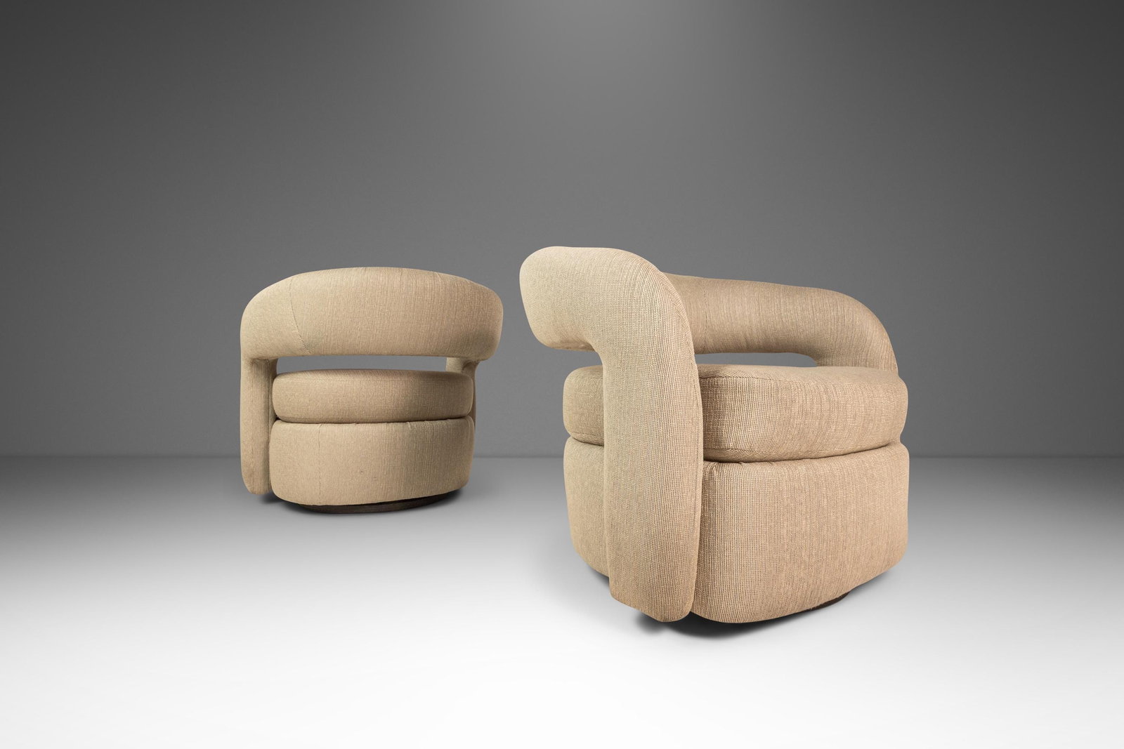 Pair of Mid-Century Modern Targa Swivel Chairs by Weiman for Interlude Home: Pair of Mid-Century Modern Targa Swivel Chairs by Weiman for Interlude Home This elegant set of two Mid-Century Modern "Targa" swivel chairs, designed by Weiman for Interlude Home and inspired by the 