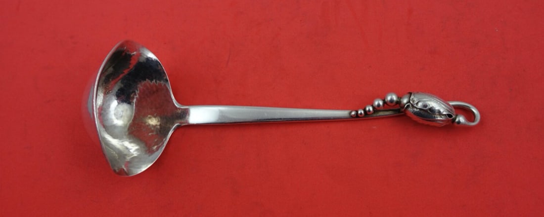 Georg Jensen Blossom Sterling Silver Gravy Ladle 7 inch with Spouts: Georg Jensen Blossom Sterling Silver Gravy Ladle 7 inch with Spouts Experience the elegance of the Blossom pattern by Georg Jensen with this exquisite Sterling Silver Gravy Ladle. Measuring 7 inches, 