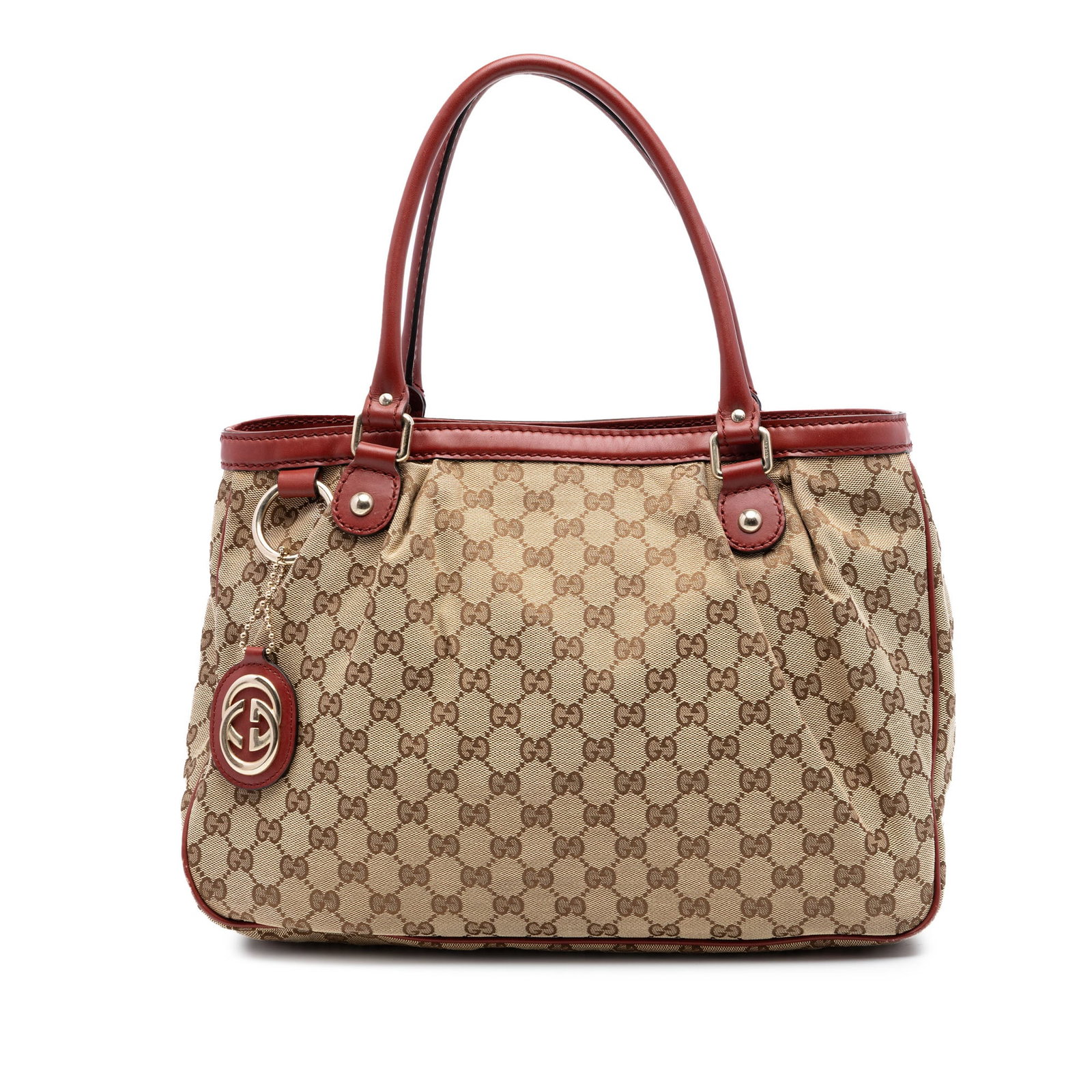 Gucci Sukey GG Canvas Tote Bag: Gucci Sukey GG Canvas Tote Bag The Gucci GG Canvas Sukey Tote features a beige fabric body with leather trim and rolled leather handles. It offers an open top with a magnetic snap button closure, an i