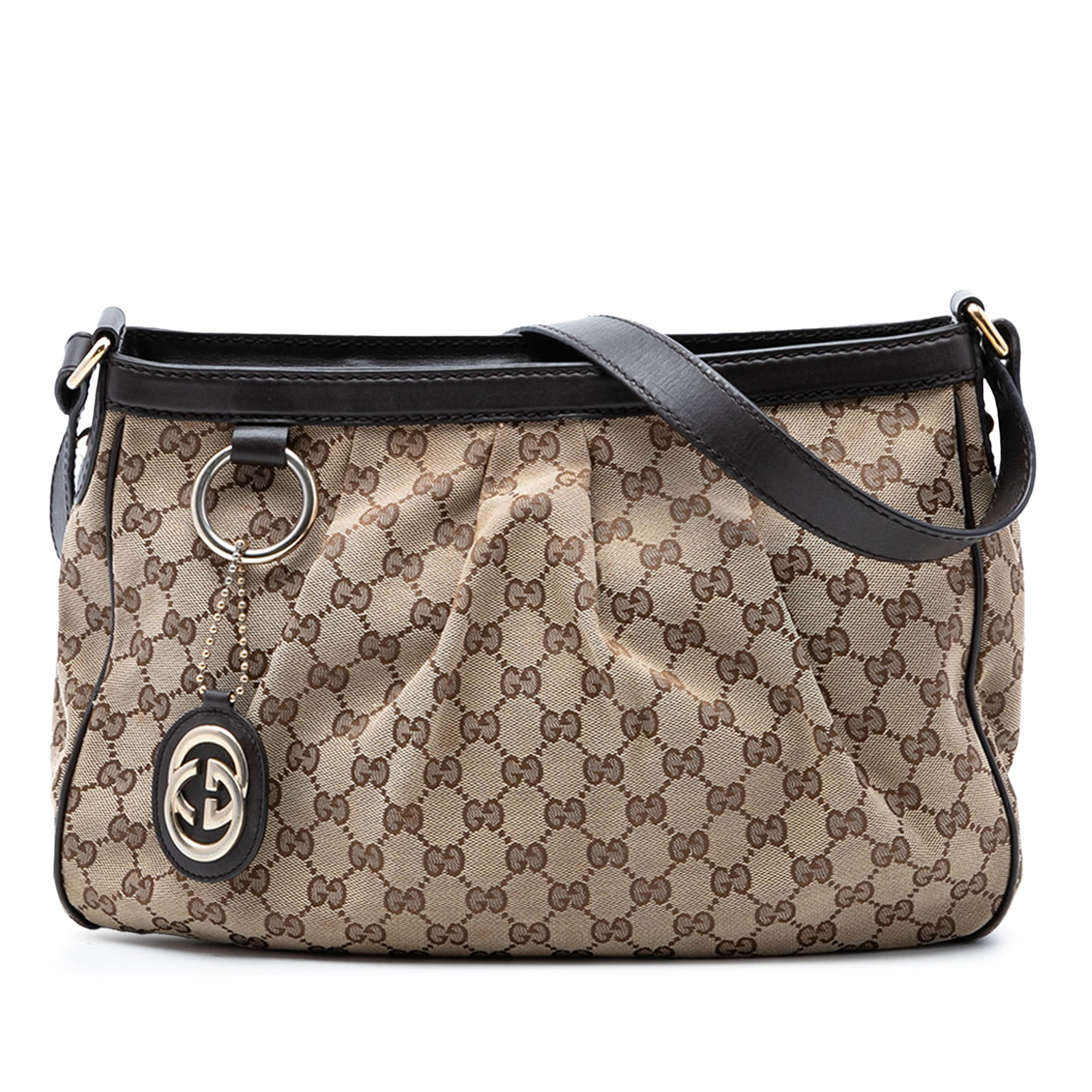 Gucci Sukey GG Canvas Crossbody Bag with Leather Trim: Gucci Sukey GG Canvas Crossbody Bag with Leather Trim Gucci Sukey crossbody bag in beige GG canvas with leather trim. This bag features a flat leather shoulder strap, top zip closure, and an interior 