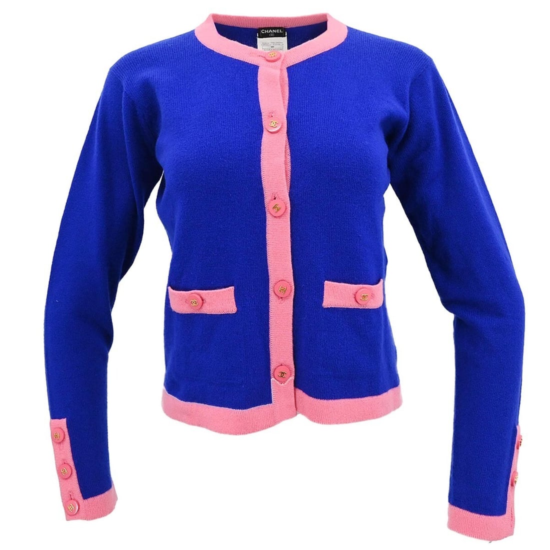 CHANEL 95A cashmere knit cardigan women size 44 blue pink: CHANEL 95A cashmere knit cardigan women size 44 blue pink Vintage women's knit cardigan in blue with pink trim and button accents. This long sleeve Chanel cardigan is made from 100% cashmere and featu