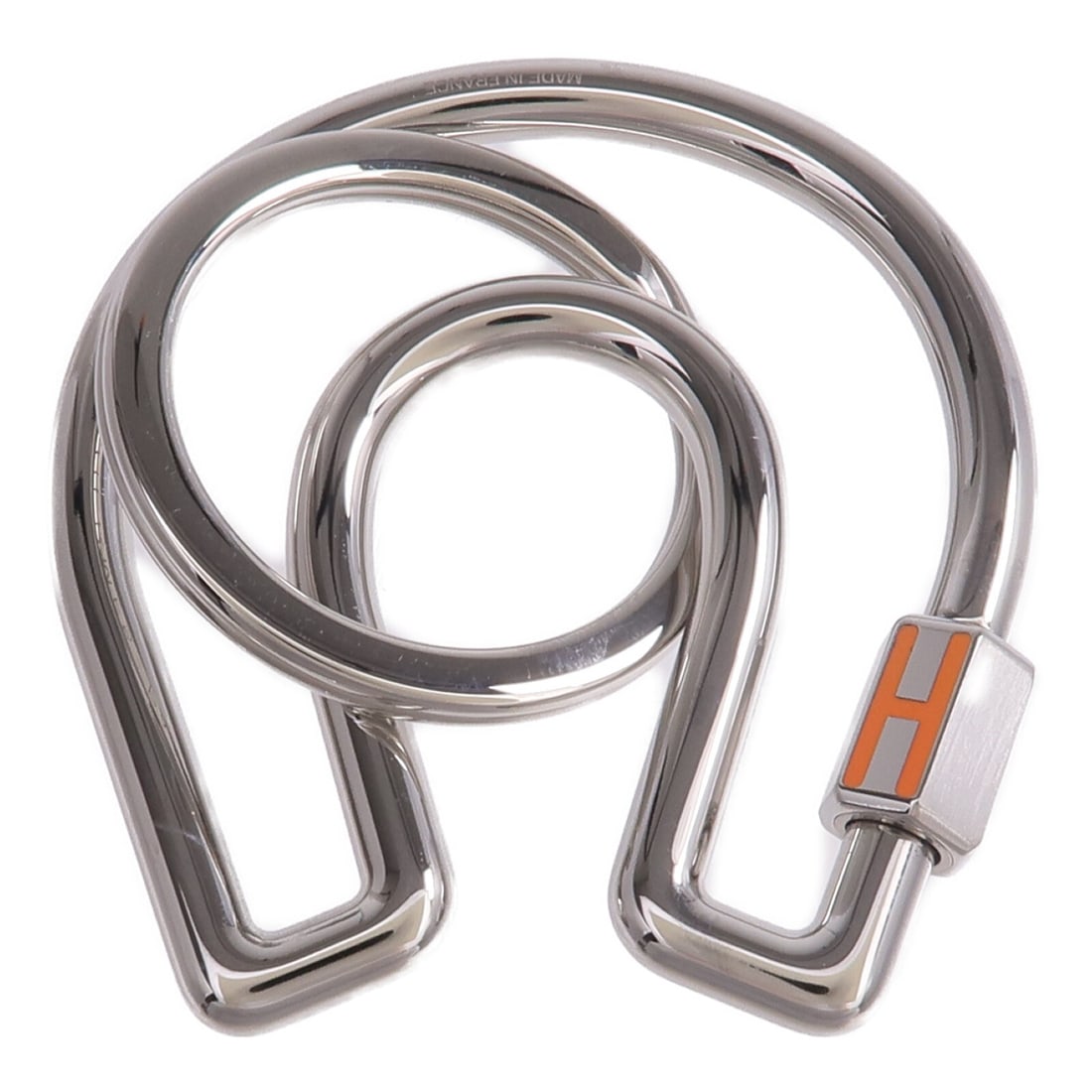 Fer A Cheval Silver Tone Key Ring with Orange Accent by Hermes: Fer A Cheval Silver Tone Key Ring with Orange Accent by Hermes This Hermes Fer A Cheval key ring features a stylish design crafted from silver-toned metal with orange accents. Suitable for unisex use,