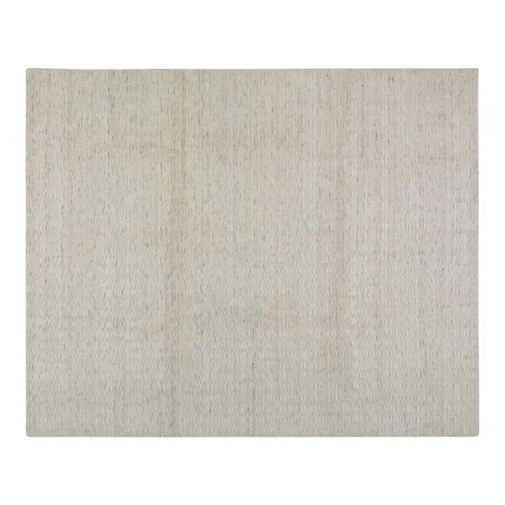 8' x 10' Hand Loomed Wool Area Rug in Minimalist Modern Style: 8' x 10' Hand Loomed Wool Area Rug in Minimalist Modern Style This contemporary minimalist rug features a hand-loomed construction in wool, offering a soft texture and subtle pattern. Its understated 