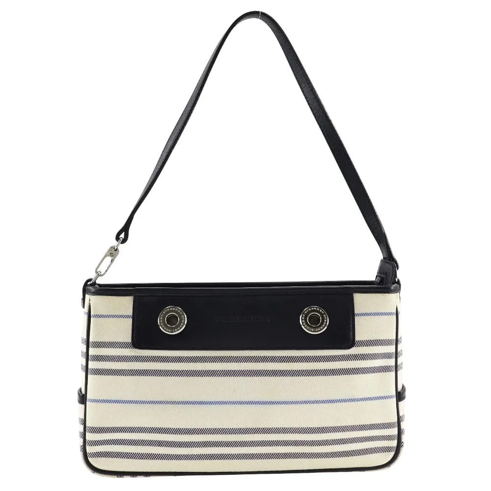 Burberry Vintage Beige Canvas Shoulder Bag 26cm: Burberry Vintage Beige Canvas Shoulder Bag 26cm This Burberry vintage shoulder bag is crafted from beige canvas and designed for women. The bag features minor stains on the exterior and interior, a pe