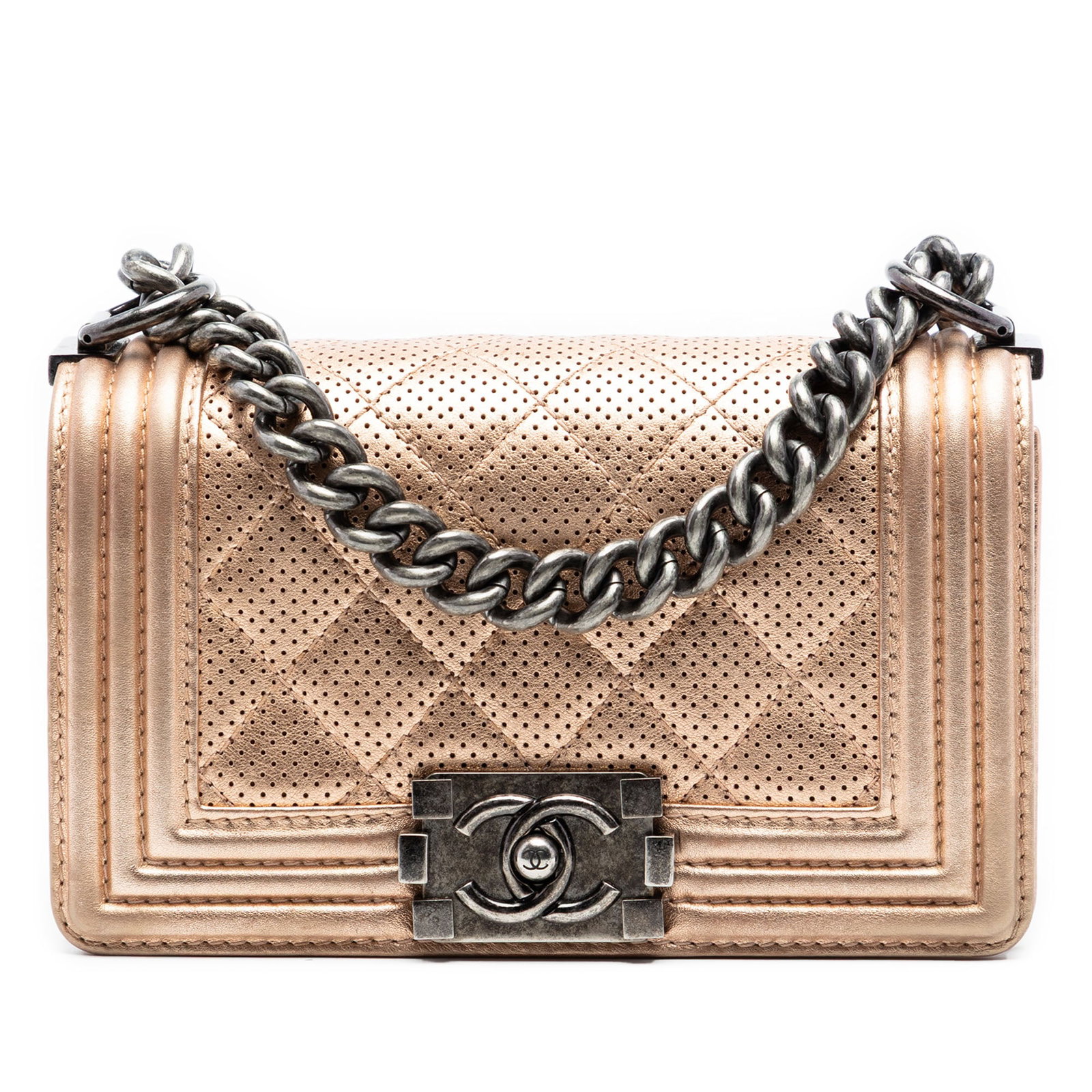 Chanel Boy Flap Pink Metallic Lambskin Quilted Bag: Chanel Boy Flap Pink Metallic Lambskin Quilted Bag This Chanel Small Quilted Perforated Metallic Lambskin Boy Flap bag features a distinctive quilted perforated metallic lambskin leather exterior in p