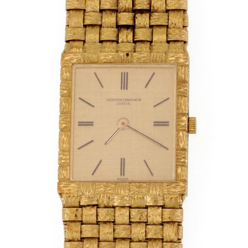 Vacheron Constantin Men's 18k Yellow Gold Hand Winding Watch with Basket Weave Band: Vacheron Constantin Men's 18k Yellow Gold Hand Winding Watch with Basket Weave Band Experience the elegance of this authentic Vacheron Constantin men's watch, featuring a luxurious design with a manua
