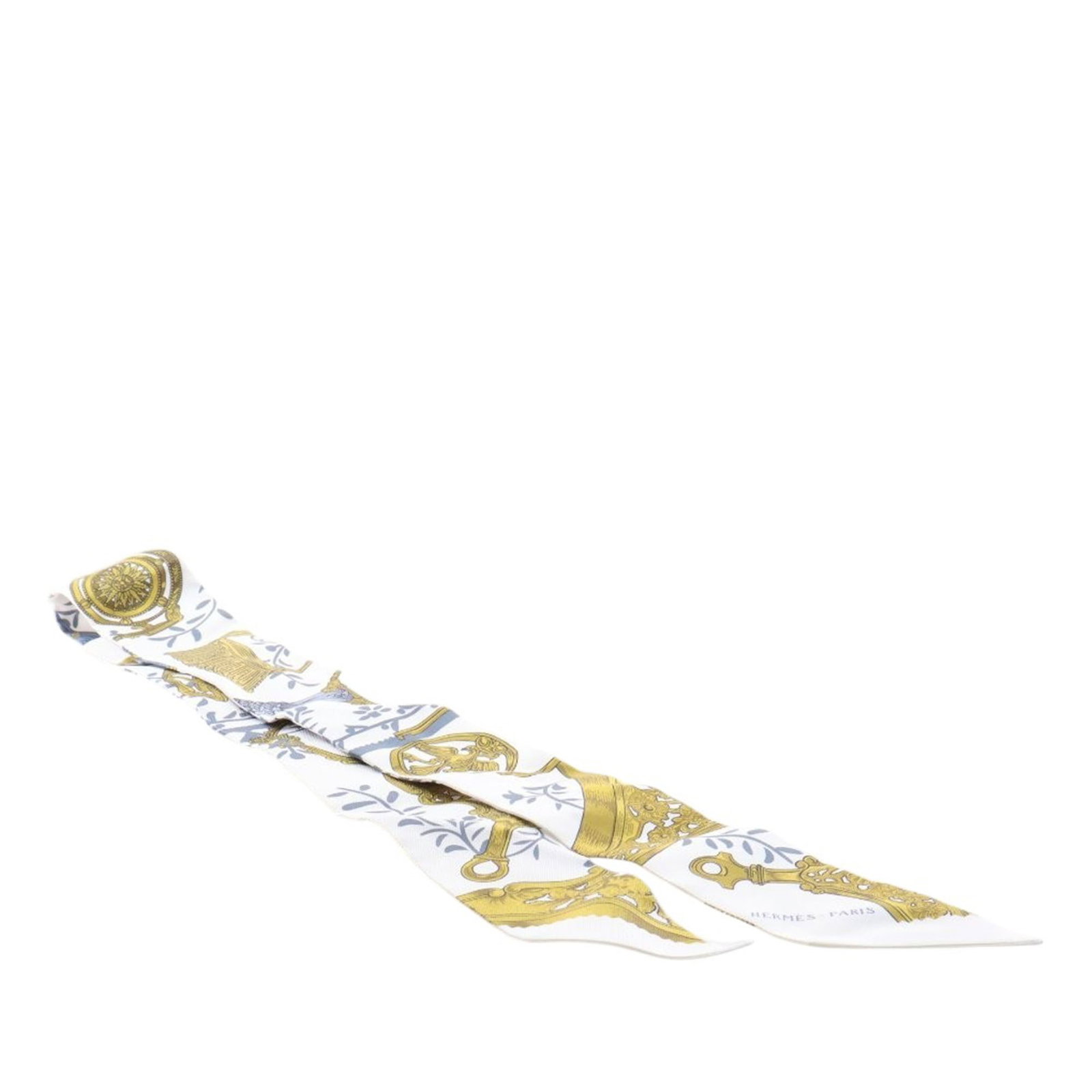 Hermes Etriers Remix White Silk Twilly: Hermes Etriers Remix White Silk Twilly This Hermes Etriers Remix Silk Twilly Scarf showcases the distinctive Etriers Remix print on luxurious 100% silk. Presented in a white colorway, this accessory i