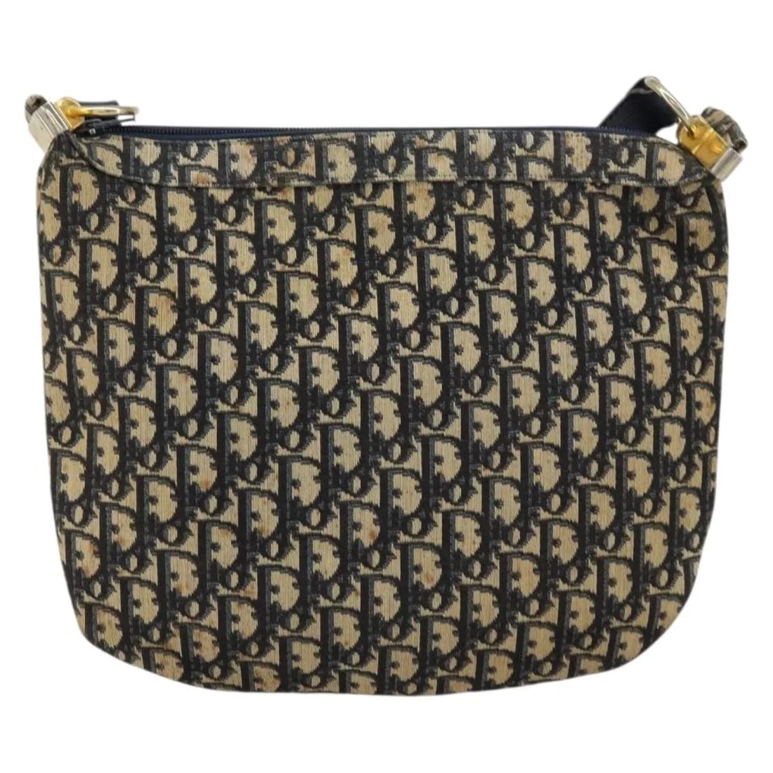 Christian Dior Vintage Trotter Navy Canvas Shoulder Bag: Christian Dior Vintage Trotter Navy Canvas Shoulder Bag This Christian Dior Vintage Trotter Shoulder Bag is crafted from navy canvas and designed for women. The bag features a spacious interior and ex
