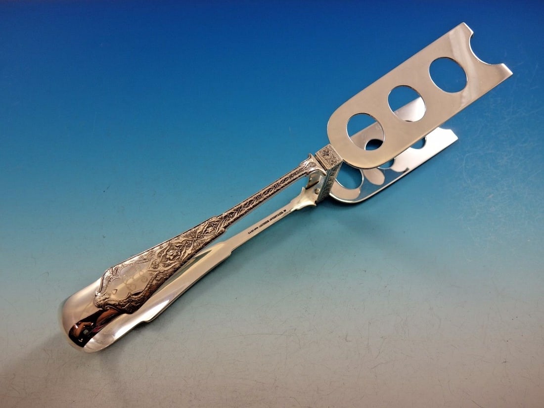 Tiffany & Co Persian Sterling Silver 10 Inch Asparagus Tongs Brite Cut: Tiffany & Co Persian Sterling Silver 10 Inch Asparagus Tongs Brite Cut A Persian pattern asparagus tong by Tiffany & Co., made of sterling silver and featuring a brite-cut design. This yoked serving p