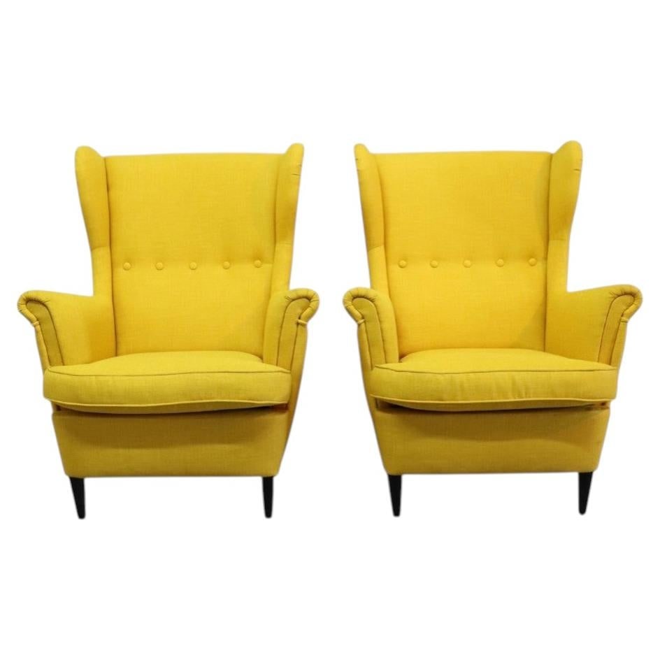 Set of 2 Strandmon wingback lounge chairs in sunshine yellow: Set of 2 Strandmon wingback lounge chairs in sunshine yellow A striking set of 2 Strandmon lounge chairs in sunshine yellow upholstery, presented in a Mid-Century Modern style. Each chair features a w