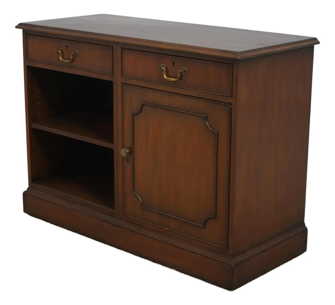 Kittinger Mahogany Credenza Cabinet with Brass Hardware: Kittinger Mahogany Credenza Cabinet with Brass Hardware This elegant Kittinger Mahogany Office Credenza Cabinet, approximately 50 years old, showcases high-quality construction and traditional style. 