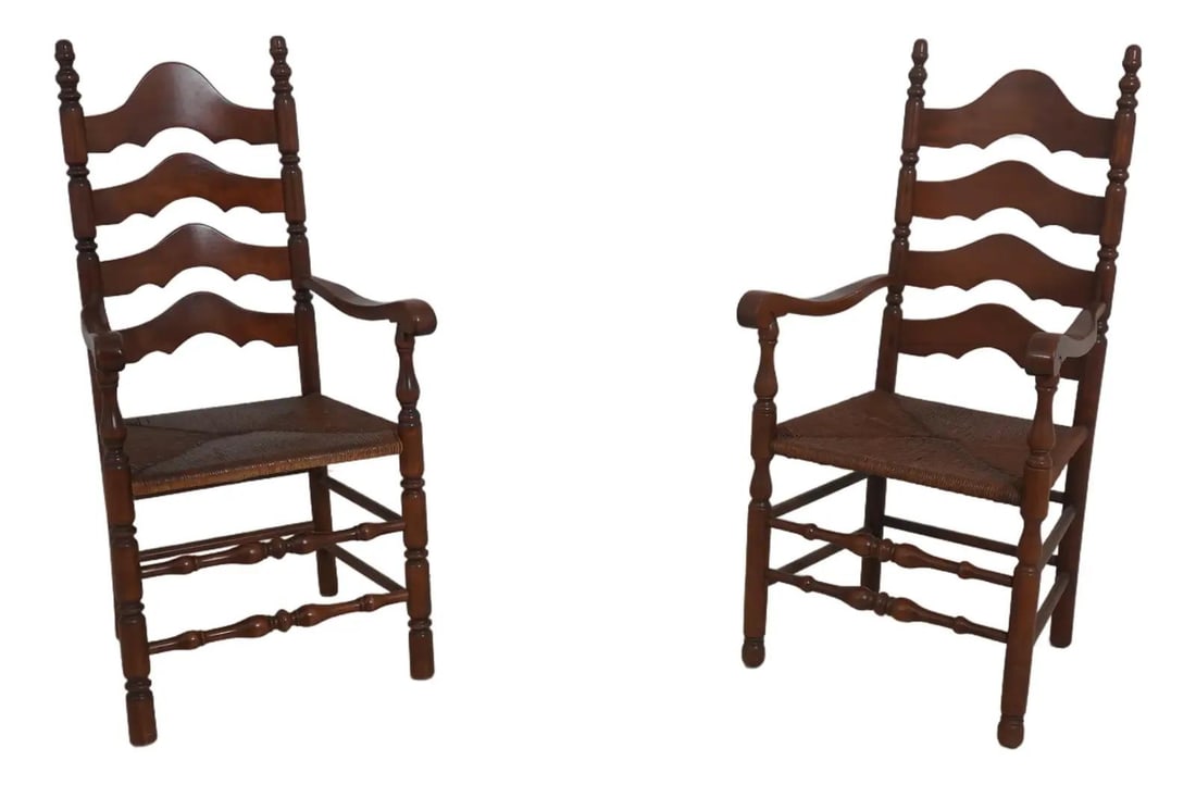 Set of Two Cherry Wood Ladder Back Armchairs with Rush Seats: Set of Two Cherry Wood Ladder Back Armchairs with Rush Seats This pair of armchairs features a classic ladder back design with cherry wood frames and rush seats. Each chair is slightly different, offe