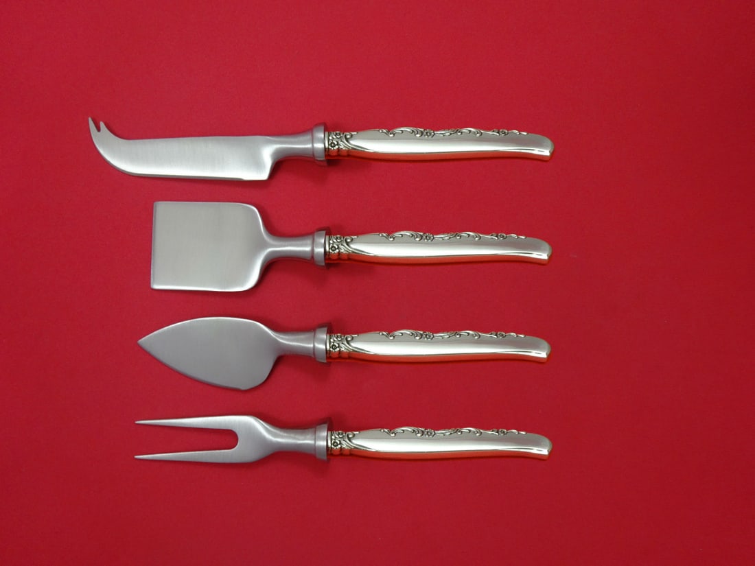 Oneida Flower Lane Sterling Silver 4-Piece Cheese Serving Set: Oneida Flower Lane Sterling Silver 4-Piece Cheese Serving Set Enhance your entertaining experience with this exquisite Flower Lane by Oneida Sterling Silver Cheese Serving Set. This 4-piece hostess se