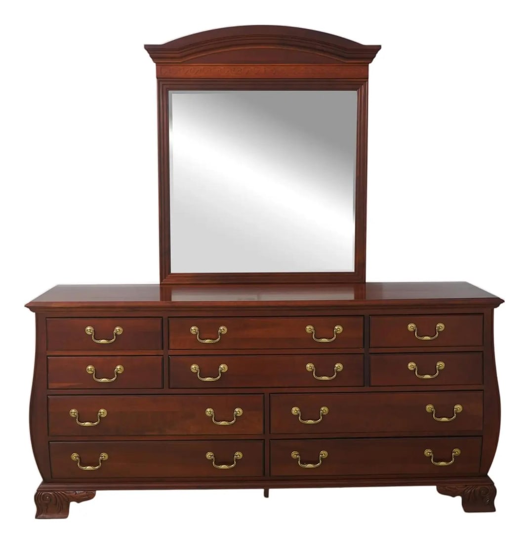 Cherry Wood Bombe Dresser with Mirror by Pennsylvania House: Cherry Wood Bombe Dresser with Mirror by Pennsylvania House This Pennsylvania House bombe side dresser features a traditional design crafted from cherry wood with solid brass hardware. It offers dovet