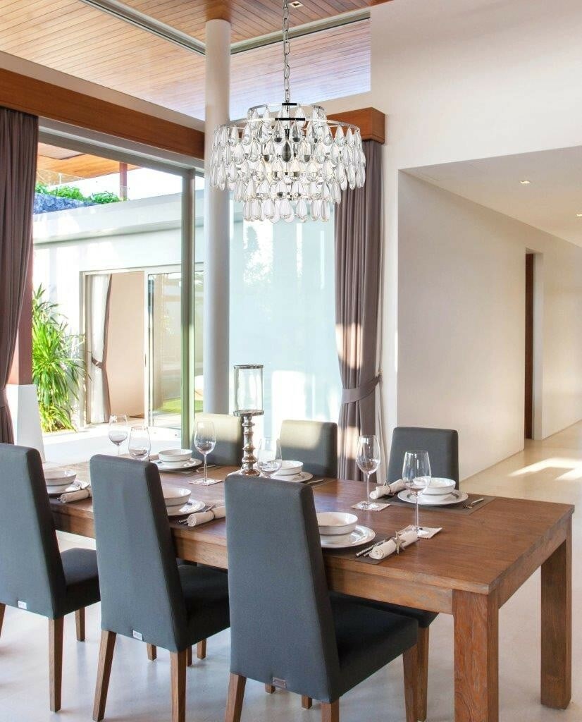 Living District Mila 5-Light Crystal Pendant Chrome: Living District Mila 5-Light Crystal Pendant Chrome This modern pendant chandelier features five lights and elegant chrome and silver finishes, complemented by high-quality crystal and glass drops. De